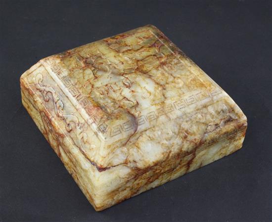 A Chinese archaistic stained and waxed bowenite jade scholars scroll weight, 11cm